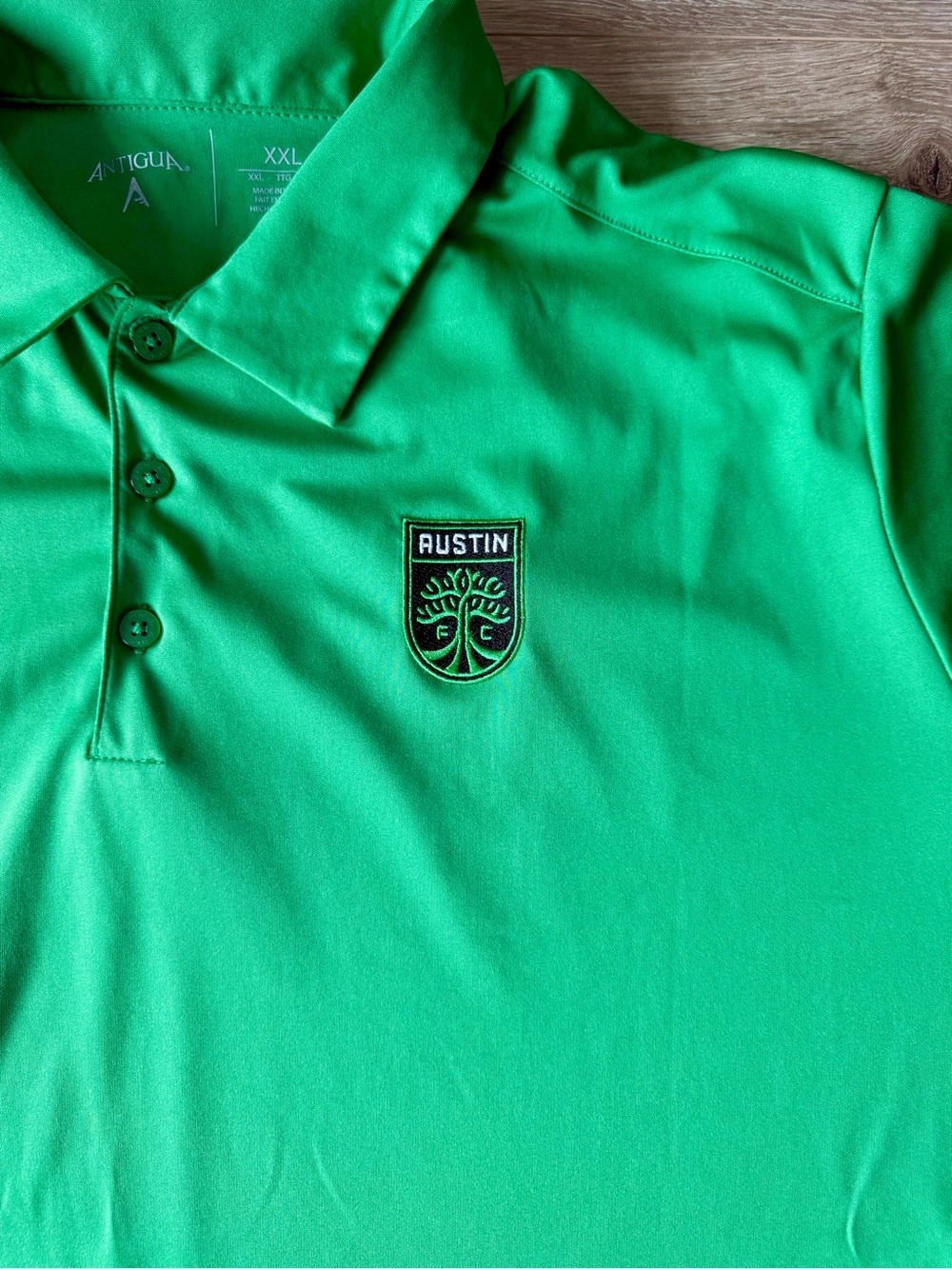 Antigua Austin Green Polo Shirt with Embroidered Crest